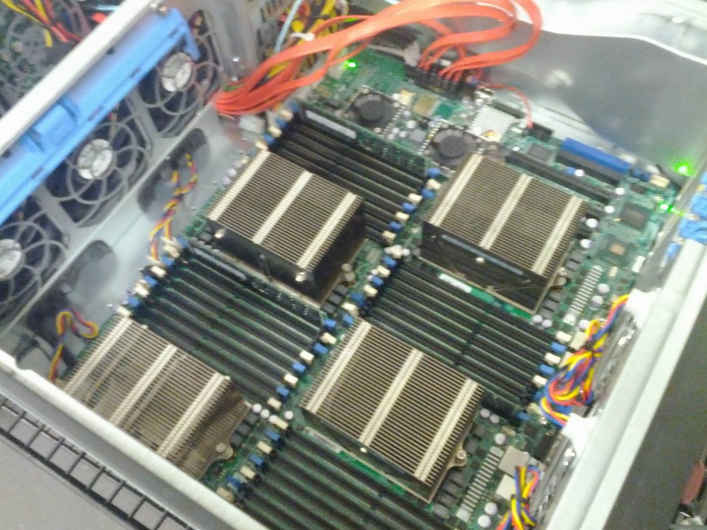 Interior of a rack server showing a dual socket motherboard, memory banks and cabling.